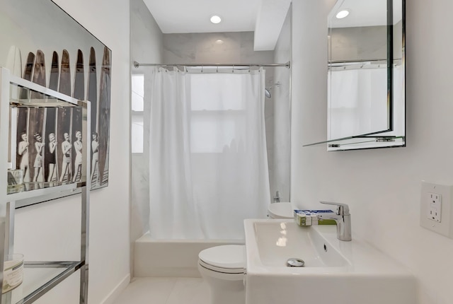 bathroom with tile patterned floors, toilet, and shower / bath combo with shower curtain