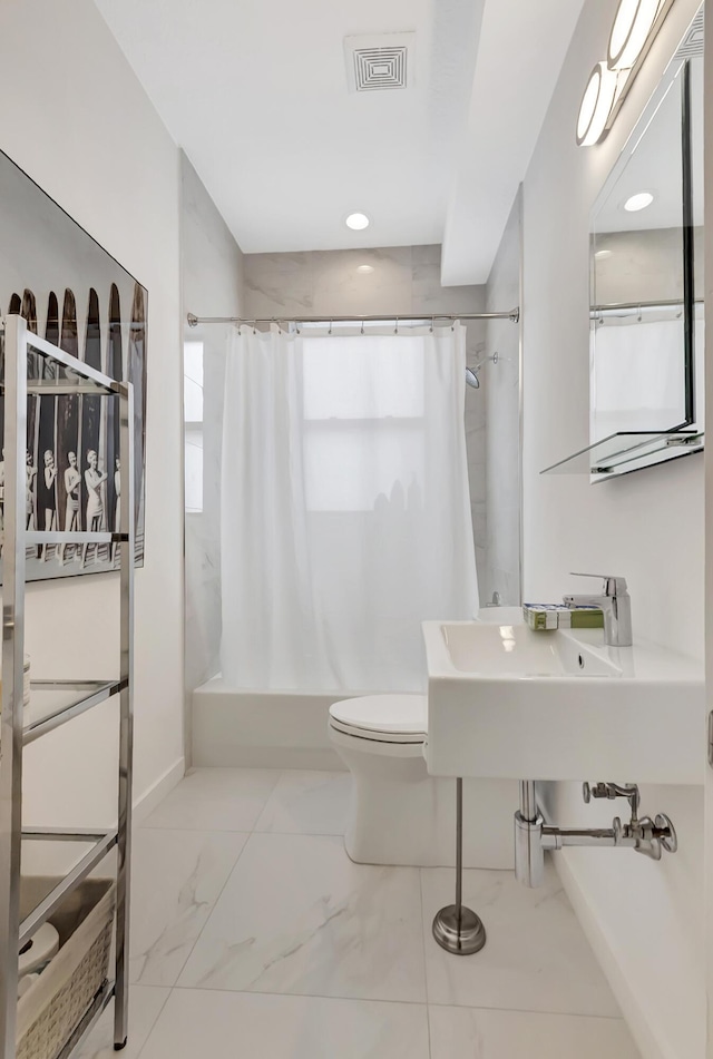 bathroom with toilet and sink