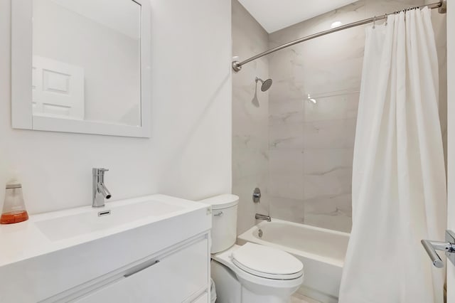 full bathroom featuring shower / tub combo, vanity, and toilet