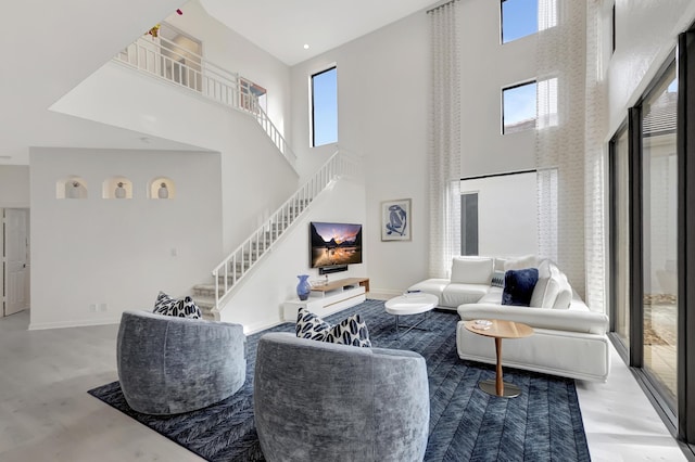 living room featuring plenty of natural light and a high ceiling