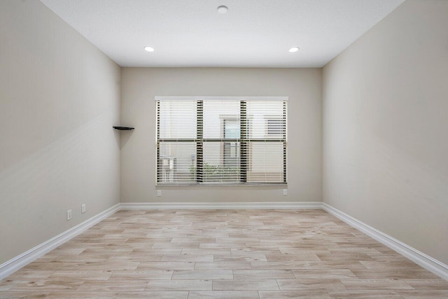 spare room featuring light wood-type flooring