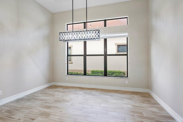 unfurnished dining area with light hardwood / wood-style flooring