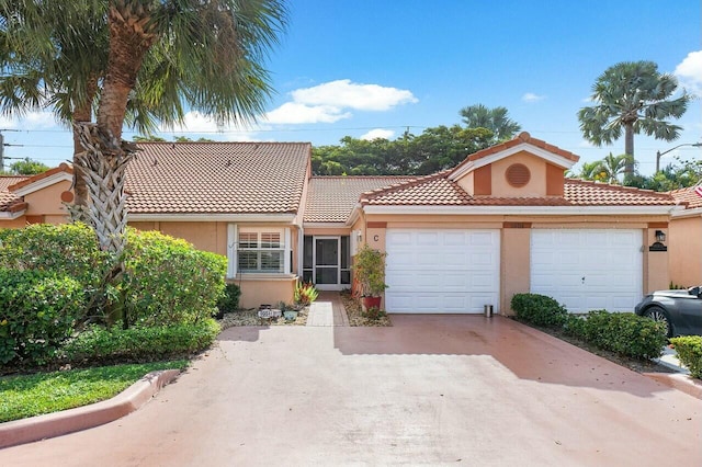 mediterranean / spanish-style home featuring a garage