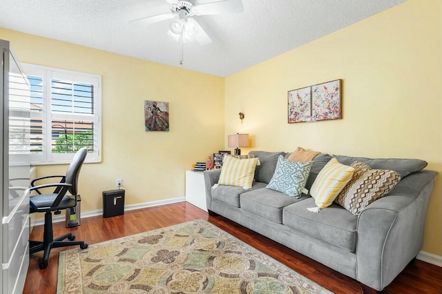 office featuring hardwood / wood-style floors, ceiling fan, and a textured ceiling