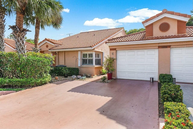 mediterranean / spanish house with a garage