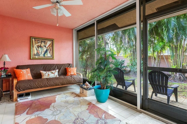 sunroom / solarium featuring ceiling fan