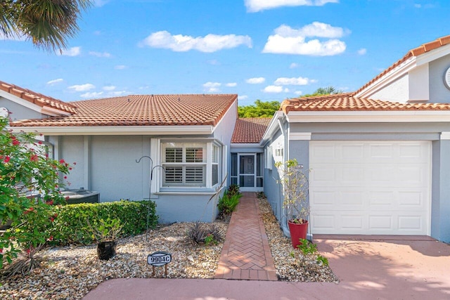 9904 Summerbrook Ter Unit C, Boynton Beach, FL 33437 - mediterranean / spanish-style house with a garage, a tile roof, stucco siding, and concrete driveway