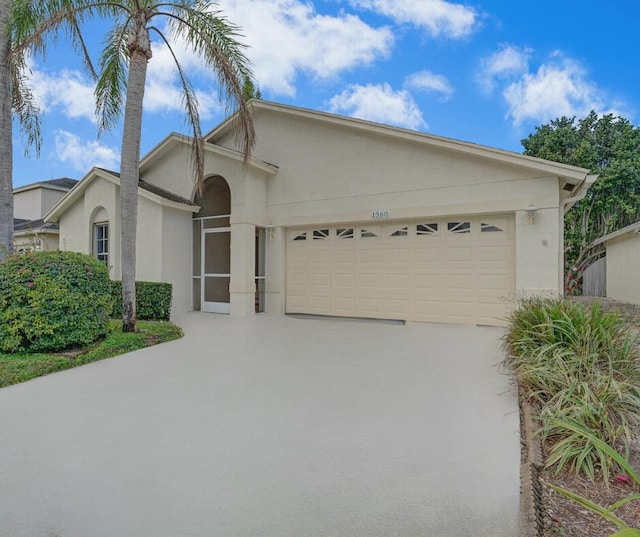 ranch-style home featuring a garage