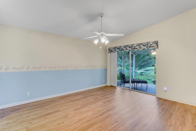 spare room featuring vaulted ceiling, light hardwood / wood-style flooring, and ceiling fan