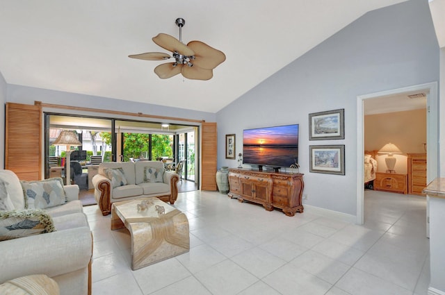 tiled living room with ceiling fan and high vaulted ceiling