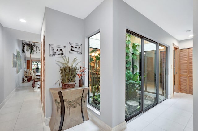 corridor featuring light tile patterned flooring