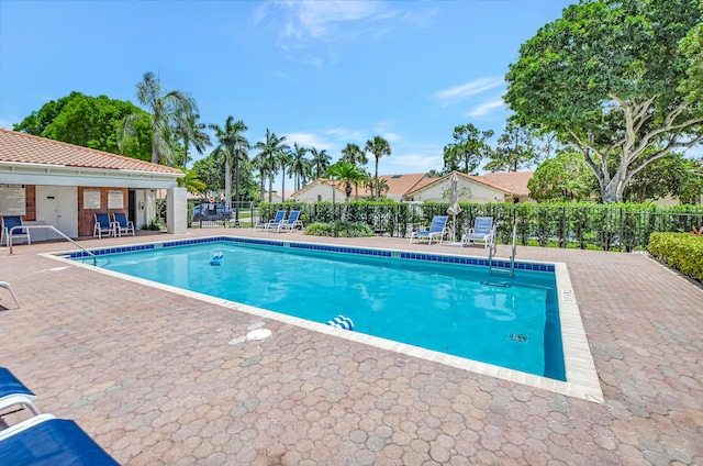 view of pool featuring a patio