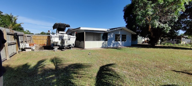 view of side of home featuring a lawn