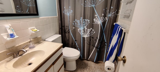 bathroom featuring a shower with curtain, vanity, toilet, and tile walls