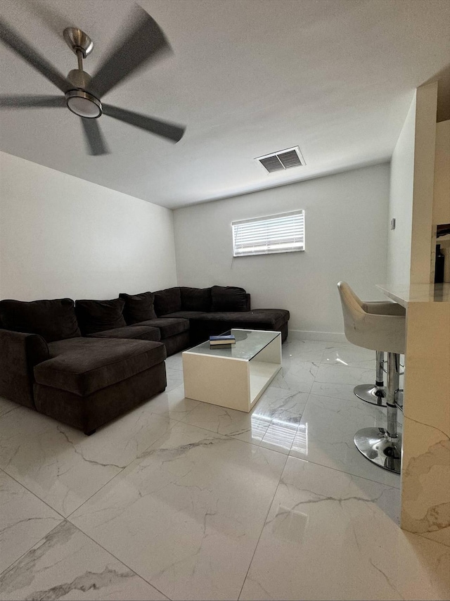 living room featuring ceiling fan