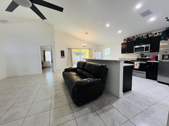 tiled living room featuring lofted ceiling and ceiling fan