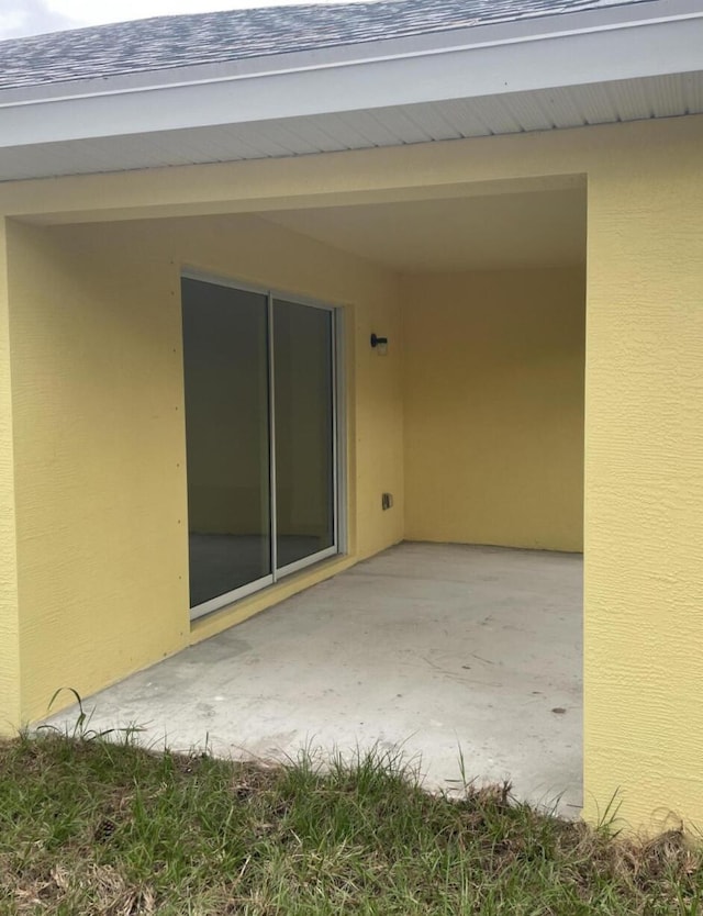 doorway to property with a patio