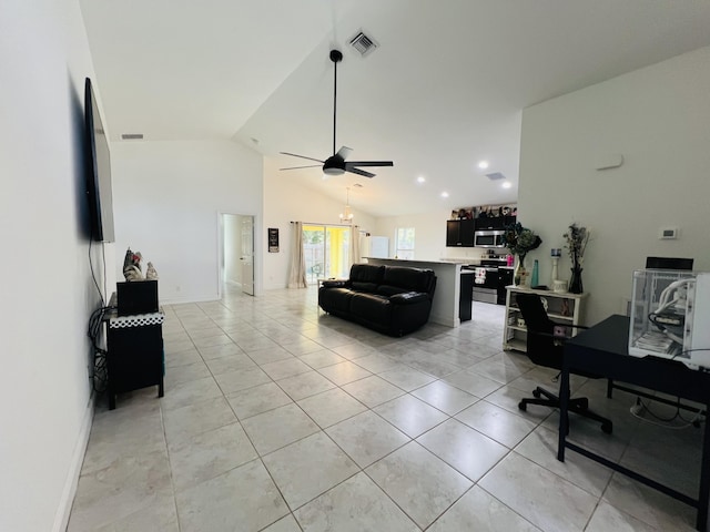 living room featuring ceiling fan, vaulted ceiling, and light tile patterned floors