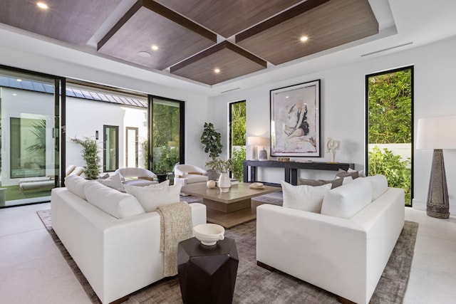 tiled living room featuring a raised ceiling, plenty of natural light, and wood ceiling