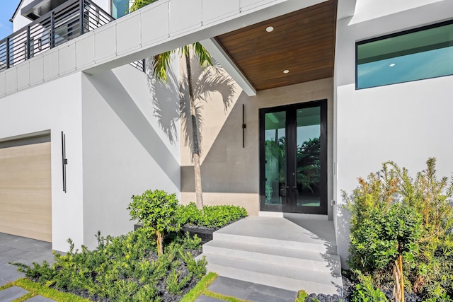 entrance to property with french doors and a garage