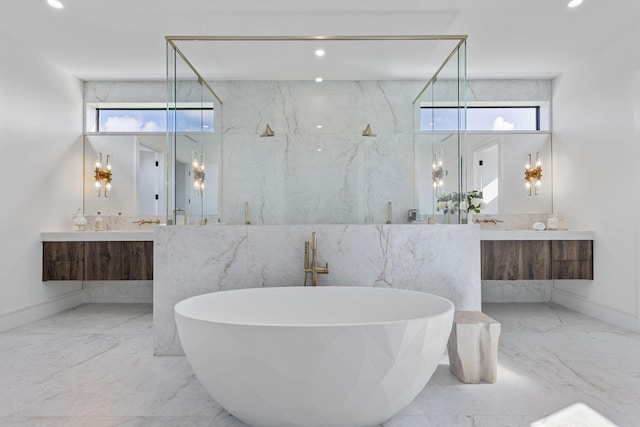 bathroom with vanity and independent shower and bath