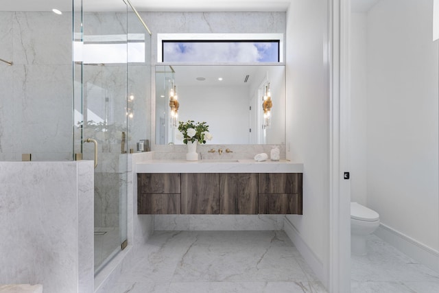 bathroom featuring vanity, toilet, and an enclosed shower