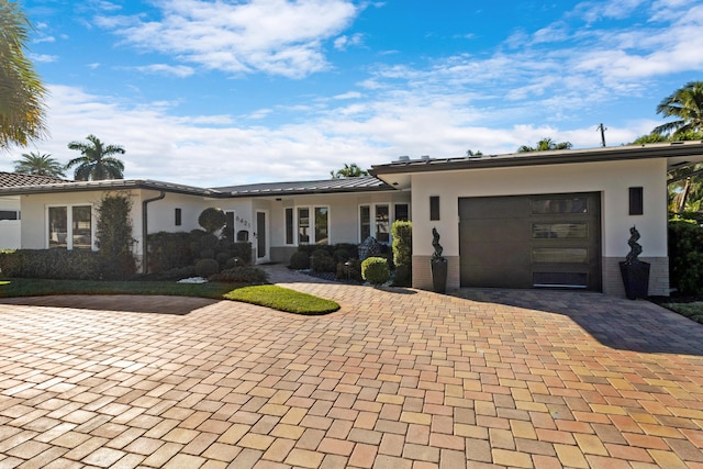 ranch-style home with a garage