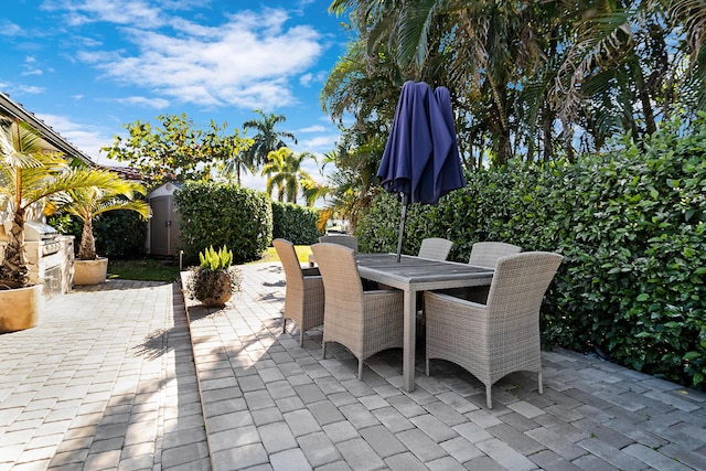 view of patio / terrace featuring a storage unit