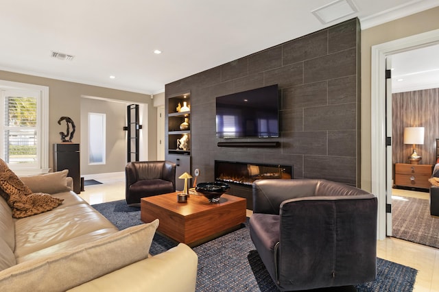 living room with a tile fireplace, built in features, tile walls, and crown molding