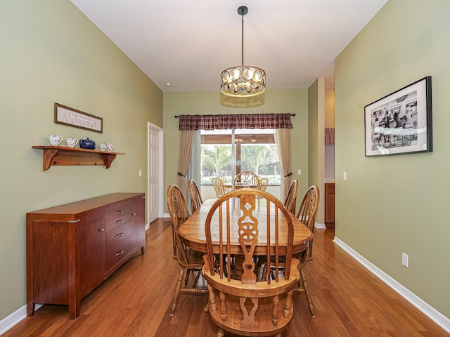 dining room featuring a chandelier and hardwood / wood-style floors