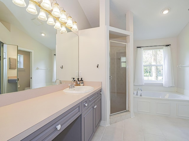 full bathroom featuring tile patterned flooring, vanity, separate shower and tub, and toilet