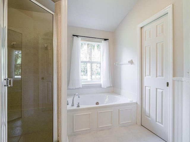 bathroom with tile patterned floors and plus walk in shower