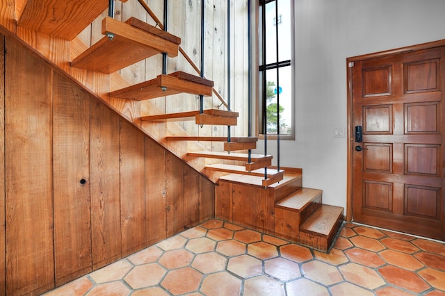 stairs with tile patterned floors