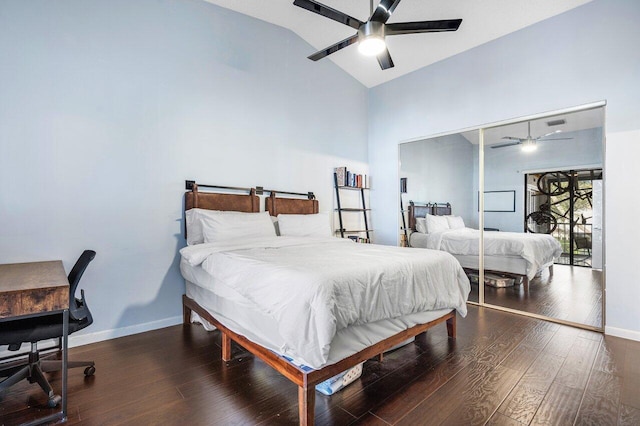 bedroom featuring ceiling fan, a closet, dark hardwood / wood-style floors, and lofted ceiling