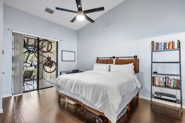 bedroom featuring access to exterior, dark hardwood / wood-style floors, ceiling fan, and lofted ceiling