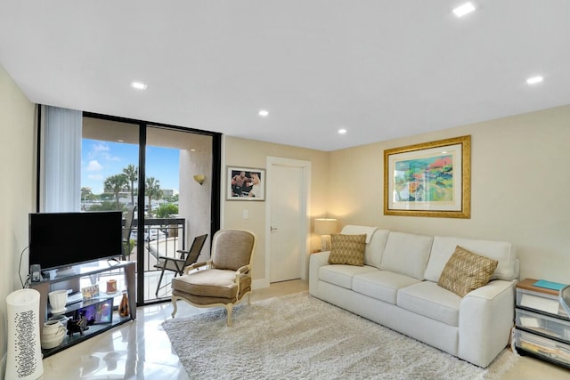 living room featuring floor to ceiling windows