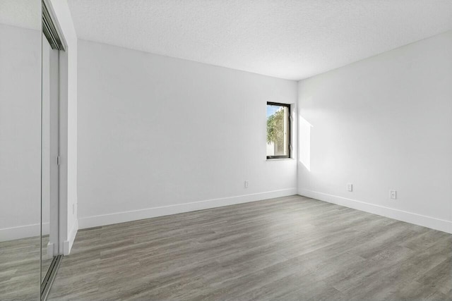 interior space featuring hardwood / wood-style floors and a textured ceiling