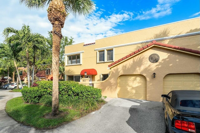 mediterranean / spanish-style house featuring a garage