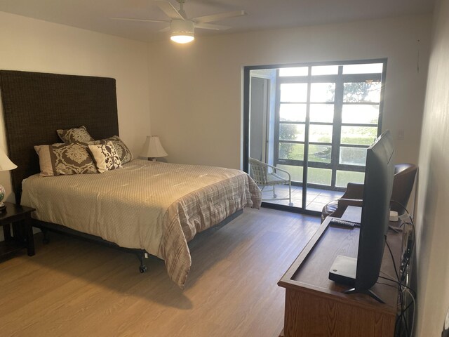 sitting room with baseboards and wood finished floors