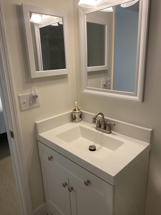 unfurnished room featuring ceiling fan, baseboards, and wood finished floors