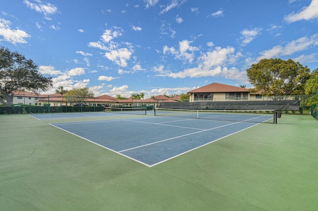 view of sport court with fence