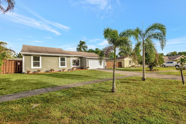 ranch-style house with a garage and a front yard