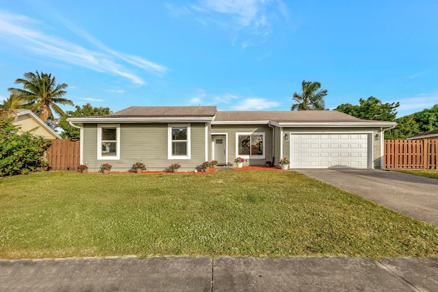 ranch-style home with a front yard and a garage