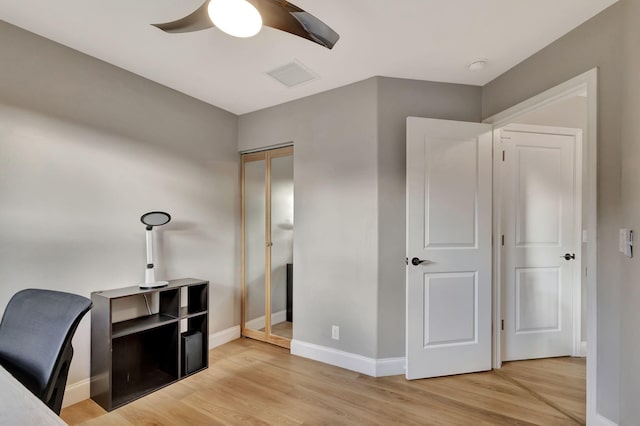 home office featuring ceiling fan and light wood-type flooring