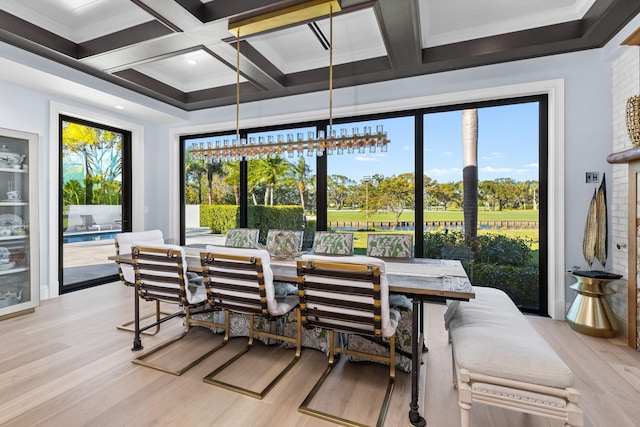 sunroom / solarium featuring beamed ceiling and coffered ceiling