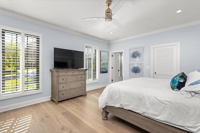 bedroom with ceiling fan, light hardwood / wood-style flooring, and crown molding