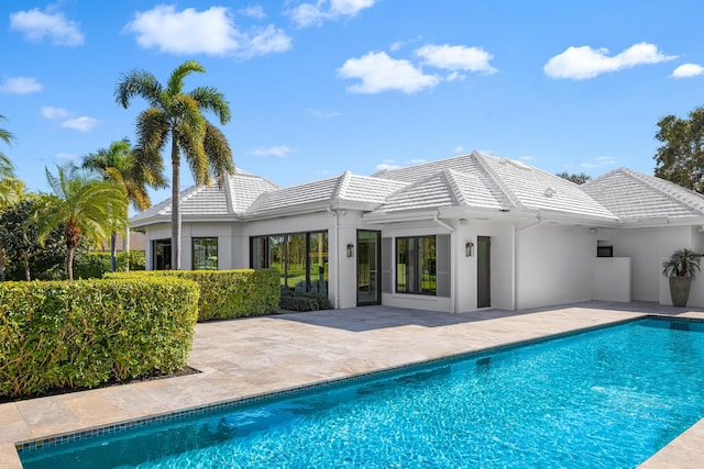 rear view of house with a patio