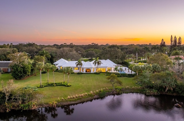 aerial view at dusk with a water view