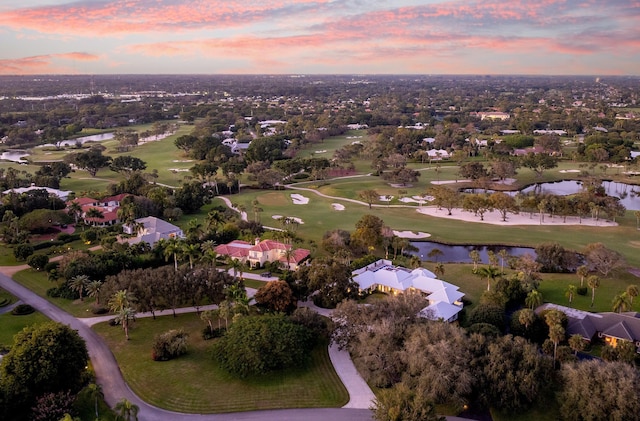 aerial view at dusk with a water view