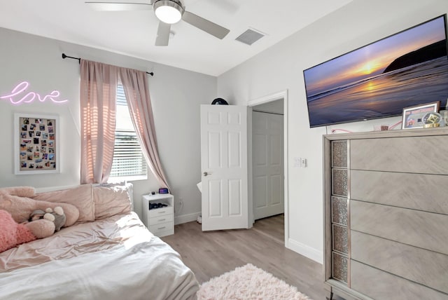 bedroom featuring ceiling fan and light hardwood / wood-style flooring